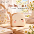 𝒔𝒊𝒍𝒌𝒆𝒏𝒗™ Smiling Toast Ceramic Ornament
